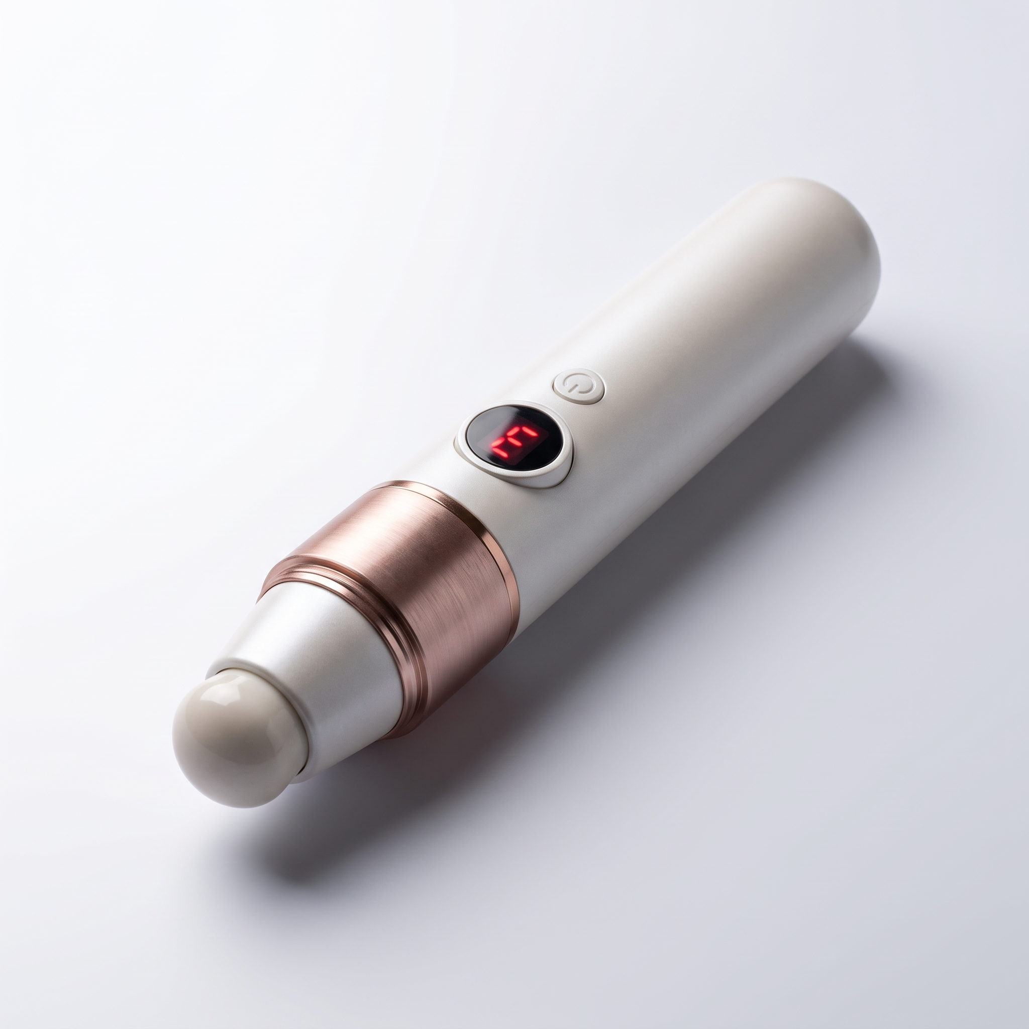 The AcuNova acupressure pen standing upright on a pale stone ledge in soft daylight